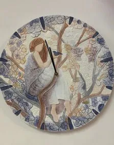 Orologio in cartapietra con ragazza Ø 45cm